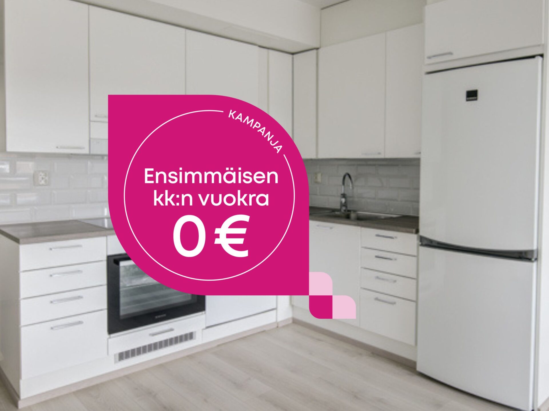 Moderni valkoinen keittiö, jossa on vaaleanpunainen mainosgrafiikka, jossa lukee: KAMPANJA Ensimmäisen kuukauden vuokra 0 €.